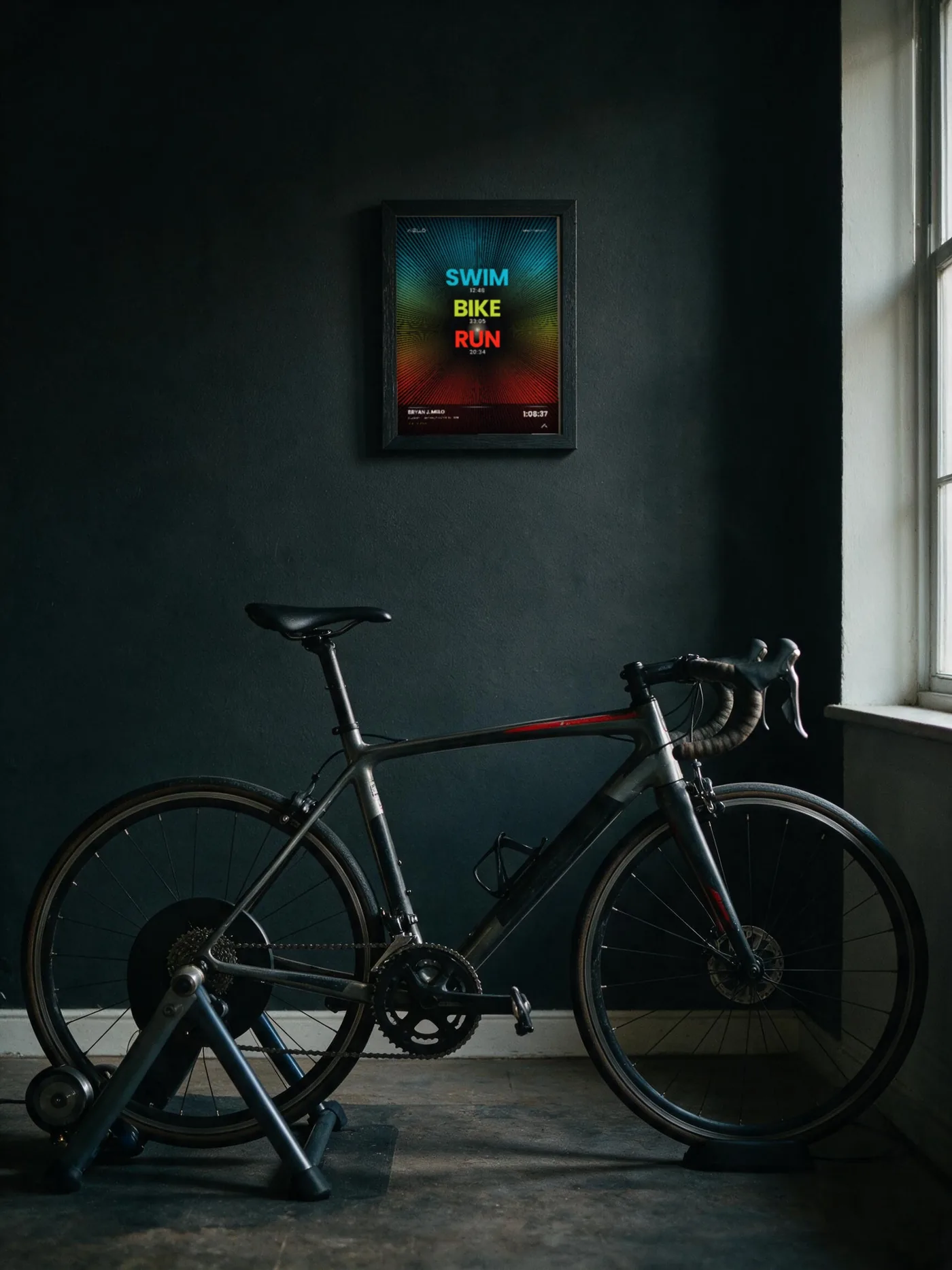 Velocidad design on a dark wall next to a bike